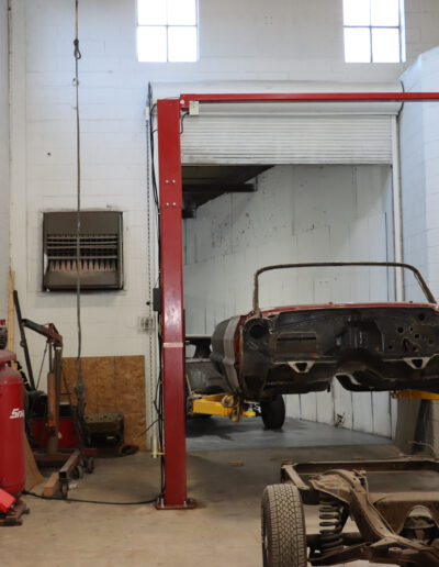 Car on lift ready for paint